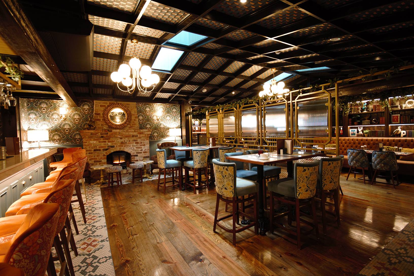Luxurious pub interior refurbishment featuring bespoke joinery, elegant seating, brick fireplace, and stylish feature wall, completed by H Forde Construction Ltd in Ireland
